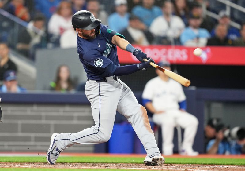 Apr 9, 2024; Toronto, Ontario, CAN; Seattle Mariners right fielder Mitch Haniger (17) hits a two run home run against the Toronto Blue Jays during the eighth inning at Rogers Centre. Mandatory Credit: Nick Turchiaro-USA TODAY Sports