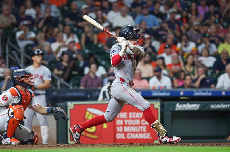 Aug 20, 2024; Houston, Texas, USA; Boston Red Sox center fielder Jarren Duran (16) hits a home run during the eighth inning against the Houston Astros at Minute Maid Park. Mandatory Credit: Troy Taormina-USA TODAY Sports