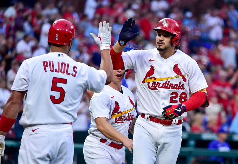 Apr 12, 2022; St. Louis, Missouri, USA;  St. Louis Cardinals third baseman Nolan Arenado (28) celebrates with designated hitter Albert Pujols (5) after hitting a two run home run against the Kansas City Royals during the first inning at Busch Stadium. Mandatory Credit: Jeff Curry-USA TODAY Sports