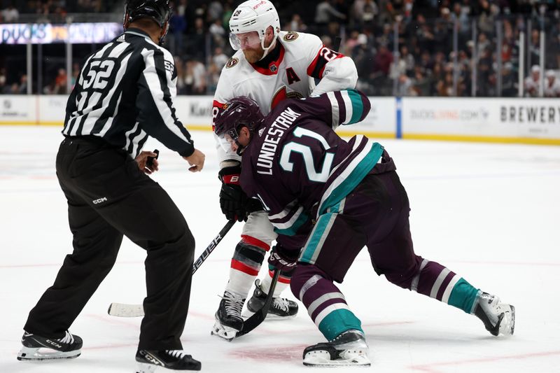 Mar 6, 2024; Anaheim, California, USA;  Ottawa Senators right wing Claude Giroux (28) and Anaheim Ducks center Isac Lundestrom (21) face off during the third period at Honda Center. Mandatory Credit: Kiyoshi Mio-USA TODAY Sports