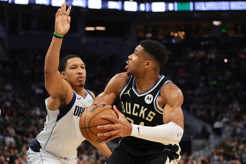 MILWAUKEE, WISCONSIN - NOVEMBER 18: Giannis Antetokounmpo #34 of the Milwaukee Bucks is defended by Grant Williams #3 of the Dallas Mavericks during the first half of a game at Fiserv Forum on November 18, 2023 in Milwaukee, Wisconsin. NOTE TO USER: User expressly acknowledges and agrees that, by downloading and or using this photograph, User is consenting to the terms and conditions of the Getty Images License Agreement. (Photo by Stacy Revere/Getty Images)