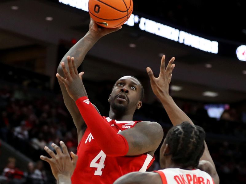 Feb 29, 2024; Columbus, Ohio, USA;  Nebraska Cornhuskers forward Juwan Gary (4) shoots as Ohio State Buckeyes center Felix Okpara (34) defends during the first half at Value City Arena. Mandatory Credit: Joseph Maiorana-USA TODAY Sports