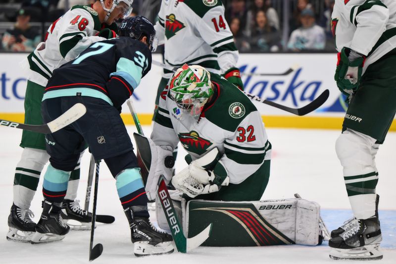 Dec 10, 2023; Seattle, Washington, USA; Minnesota Wild goaltender Filip Gustavsson (32) blocks a goal shot against the Seattle Kraken during the second period at Climate Pledge Arena. Mandatory Credit: Steven Bisig-USA TODAY Sports