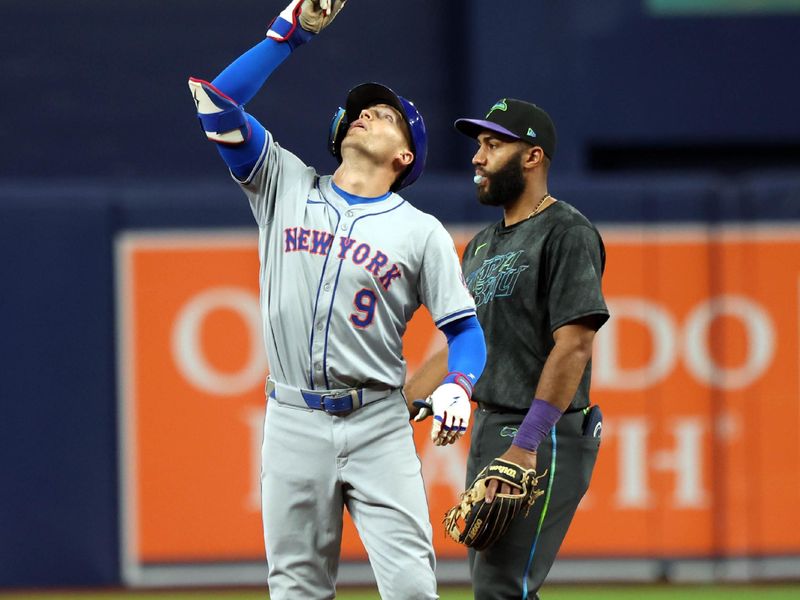 May 3, 2024; St. Petersburg, Florida, USA; New York Mets outfielder Brandon Nimmo (9) celebrates after he doubles against the Tampa Bay Rays during the ninth inning  at Tropicana Field. Mandatory Credit: Kim Klement Neitzel-USA TODAY Sports