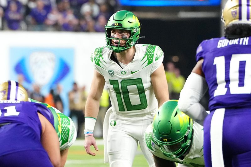 Dec 1, 2023; Las Vegas, NV, USA; Oregon Ducks quarterback Bo Nix (10) prepares to hike the ball against the Washington Huskies during the third quarter at Allegiant Stadium. Mandatory Credit: Stephen R. Sylvanie-USA TODAY Sports