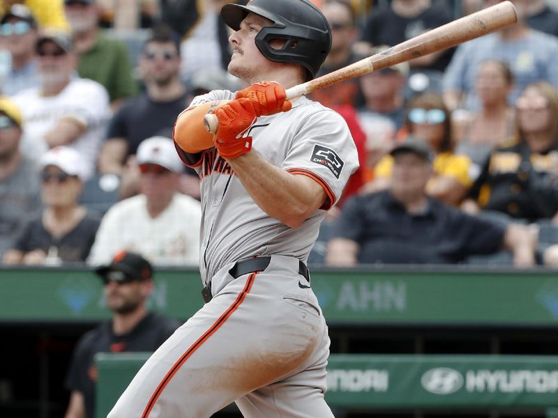 May 23, 2024; Pittsburgh, Pennsylvania, USA; San Francisco Giants third baseman Matt Chapman (26) hits a three run home run against the Pittsburgh Pirates during the ninth inning at PNC Park. The Giants won 7-6. Mandatory Credit: Charles LeClaire-USA TODAY Sports