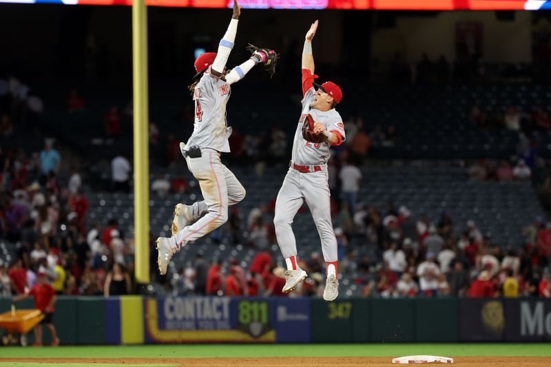 Aug 22, 2023; Anaheim, California, USA; Cincinnati Reds shortstop Elly De La Cruz (44) and center fielder TJ Friedl (29) celebrate a victory after defeating the Los Angeles Angels 4-3 at Angel Stadium. Mandatory Credit: Kiyoshi Mio-USA TODAY Sports