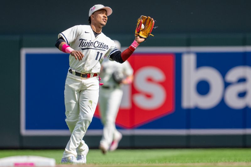 May 14, 2023; Minneapolis, Minnesota, USA; Minnesota Twins second baseman Jorge Polanco (11) catches a ball hit by Chicago Cubs third baseman Patrick Wisdom (not pictured) in the ninth inning at Target Field. Mandatory Credit: Matt Blewett-USA TODAY Sports