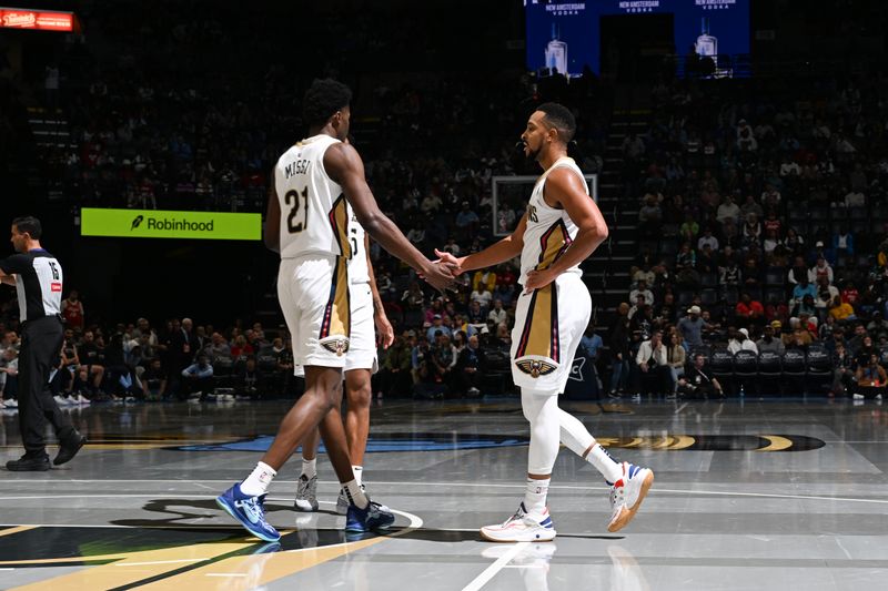 MEMPHIS, TN - NOVEMBER 29: Yves Missi #21 high fives CJ McCollum #3 of the New Orleans Pelicans during the game against the Memphis Grizzlies during the Emirates NBA Cup game on November 29, 2024 at FedExForum in Memphis, Tennessee. NOTE TO USER: User expressly acknowledges and agrees that, by downloading and or using this photograph, User is consenting to the terms and conditions of the Getty Images License Agreement. Mandatory Copyright Notice: Copyright 2024 NBAE (Photo by Grant Burke/NBAE via Getty Images)