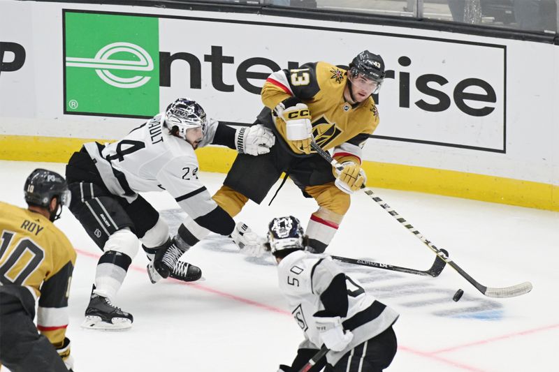 Oct 11, 2022; Los Angeles, California, USA; Vegas Golden Knights center Paul Cotter (43) plays the puck defended by Los Angeles Kings center Phillip Danault (24) in the third period at Crypto.com Arena. Mandatory Credit: Richard Mackson-USA TODAY Sports