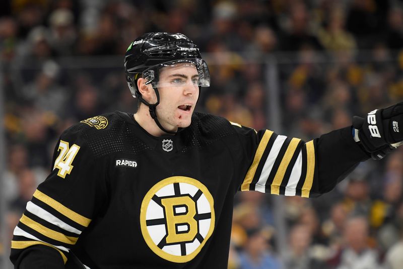 Jan 18, 2024; Boston, Massachusetts, USA; Boston Bruins left wing Jake DeBrusk (74) tries to get the attention of his line mates during the second period against the Colorado Avalanche at TD Garden. Mandatory Credit: Bob DeChiara-USA TODAY Sports