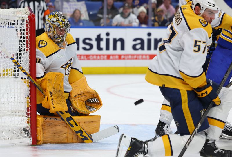 Dec 3, 2023; Buffalo, New York, USA;  Nashville Predators goaltender Juuse Saros (74) looks to make a save during the second period against the Buffalo Sabres at KeyBank Center. Mandatory Credit: Timothy T. Ludwig-USA TODAY Sports