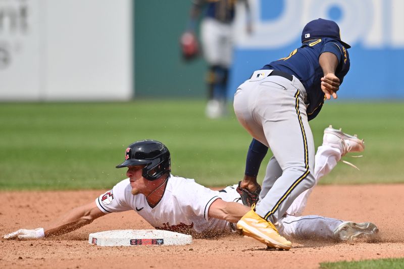 Jun 25, 2023; Cleveland, Ohio, USA; Cleveland Guardians center fielder Myles Straw (7) is caught stealing by Milwaukee Brewers second baseman Andruw Monasterio (14) during the eighth inning at Progressive Field. Mandatory Credit: Ken Blaze-USA TODAY Sports