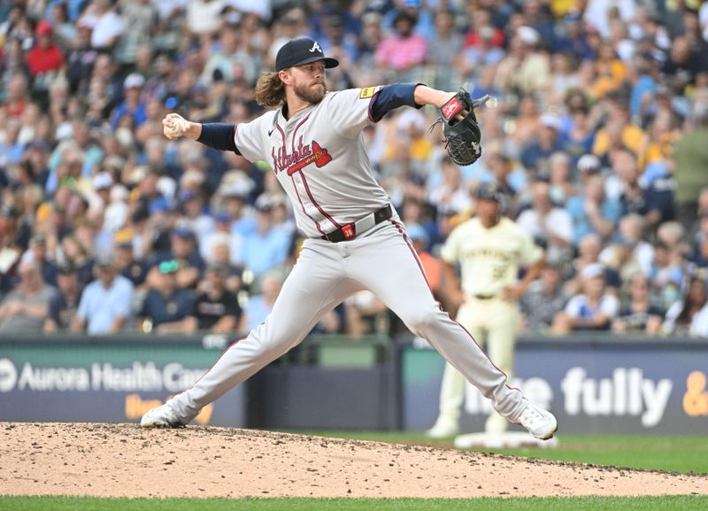 Jul 31, 2024; Milwaukee, Wisconsin, USA; Atlanta Braves pitcher Pierce Johnson (38) delivers against the Milwaukee Brewers in the fifth inning at American Family Field. Mandatory Credit: Michael McLoone-USA TODAY Sports