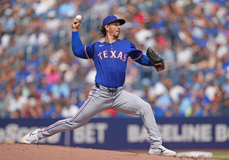 Jul 27, 2024; Toronto, Ontario, CAN; Texas Rangers starting pitcher Michael Lorenzen (23) throws a pitch against the Toronto Blue Jays during the first inning at Rogers Centre. Mandatory Credit: Nick Turchiaro-USA TODAY Sports