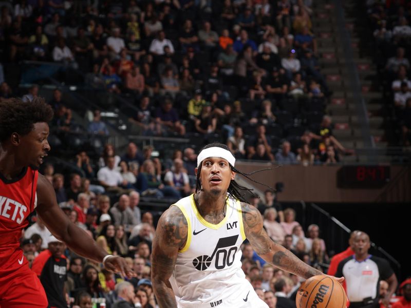 SALT LAKE CITY, UT - OCTOBER 7: Jordan Clarkson #00 of the Utah Jazz drives to the basket during the game against the Houston Rockets during a NBA preseason game on October 7, 2024 at the Delta Center in Salt Lake City, Utah. NOTE TO USER: User expressly acknowledges and agrees that, by downloading and or using this Photograph, User is consenting to the terms and conditions of the Getty Images License Agreement. Mandatory Copyright Notice: Copyright 2024 NBAE (Photo by Melissa Majchrzak/NBAE via Getty Images)