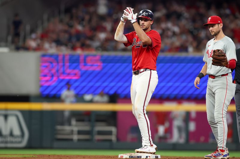 Jul 5, 2024; Atlanta, Georgia, USA; Atlanta Braves first baseman Matt Olson (28) reacts after a double against the Philadelphia Phillies in the sixth inning at Truist Park. Mandatory Credit: Brett Davis-USA TODAY Sports