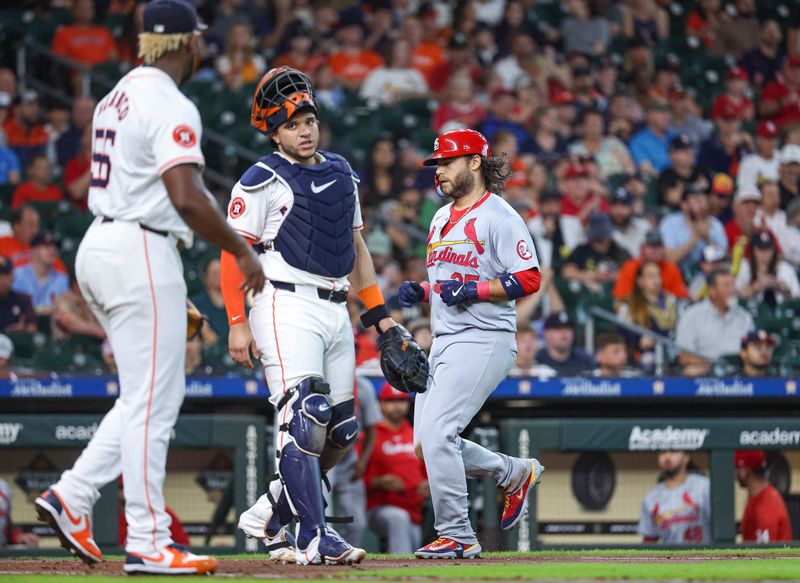 Jun 5, 2024; Houston, Texas, USA; St. Louis Cardinals shortstop Brandon Crawford (35) scores a run past Houston Astros designated hitter Yainer Diaz (21) and starting pitcher Ronel Blanco (56) during the third inning at Minute Maid Park. Mandatory Credit: Troy Taormina-USA TODAY Sports