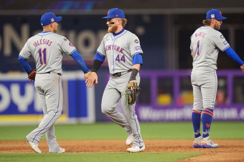 Jul 20, 2024; Miami, Florida, USA;  New York Mets outfielder Harrison Bader (44) celebrates with second baseman Jose Iglesias (11) after defeating the Miami Marlins at loanDepot Park. Mandatory Credit: Jim Rassol-USA TODAY Sports