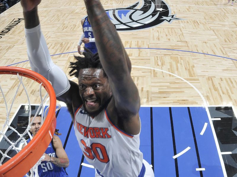 ORLANDO, FL - MARCH 23: Julius Randle #30 of the New York Knicks drives to the basket against the Orlando Magic on March 23, 2023 at Amway Center in Orlando, Florida. NOTE TO USER: User expressly acknowledges and agrees that, by downloading and or using this photograph, User is consenting to the terms and conditions of the Getty Images License Agreement. Mandatory Copyright Notice: Copyright 2023 NBAE (Photo by Fernando Medina/NBAE via Getty Images)