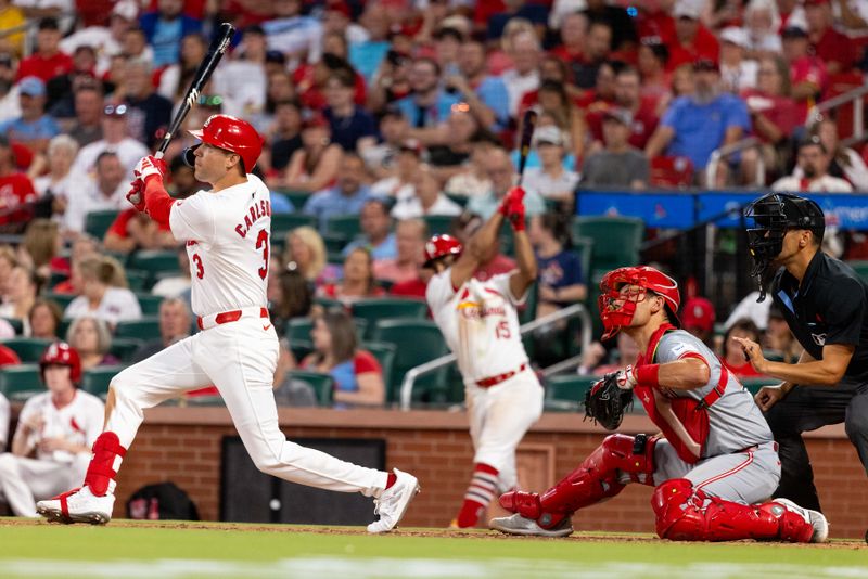 Jun 27, 2024; St. Louis, Missouri, USA; St. Louis Cardinals outfielder Dylan Carlson (3) hits a single against the Cincinnati Reds in the sixth inning at Busch Stadium. Mandatory Credit: Zach Dalin-USA TODAY Sports