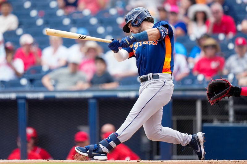 Mar 13, 2023; West Palm Beach, Florida, USA; Houston Astros third baseman Alex Bregman (2) hits a single against the Washington Nationals during the first inning at The Ballpark of the Palm Beaches. Mandatory Credit: Rich Storry-USA TODAY Sports