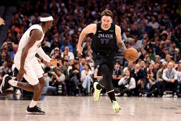 DALLAS, TEXAS - DECEMBER 27: Luka Doncic #77 of the Dallas Mavericks dribbles the ball up court in the second half against the Cleveland Cavaliers at American Airlines Center on December 27, 2023 in Dallas, Texas. NOTE TO USER: User expressly acknowledges and agrees that, by downloading and or using this photograph, User is consenting to the terms and conditions of the Getty Images License Agreement. (Photo by Tim Heitman/Getty Images)