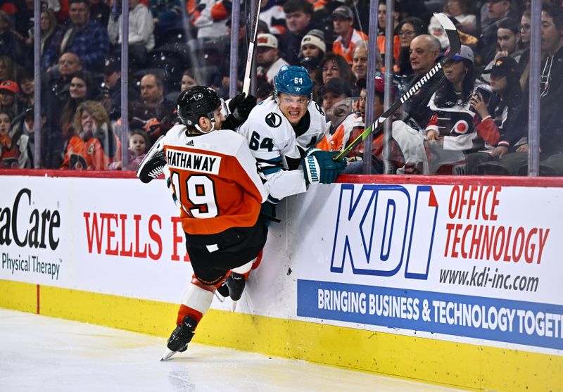 Mar 12, 2024; Philadelphia, Pennsylvania, USA; Philadelphia Flyers right wing Garnet Hathaway (19) hits San Jose Sharks center Mikael Granlund (64) in the third period at Wells Fargo Center. Mandatory Credit: Kyle Ross-USA TODAY Sports