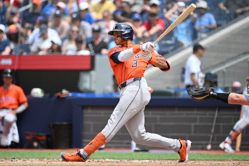 Jul 4, 2024; Toronto, Ontario, CAN; Houston Astros shortstop Jeremy Pena (3) hits a single against the Toronto Blue Jays in the fifth inning at Rogers Centre. Mandatory Credit: Dan Hamilton-USA TODAY Sports