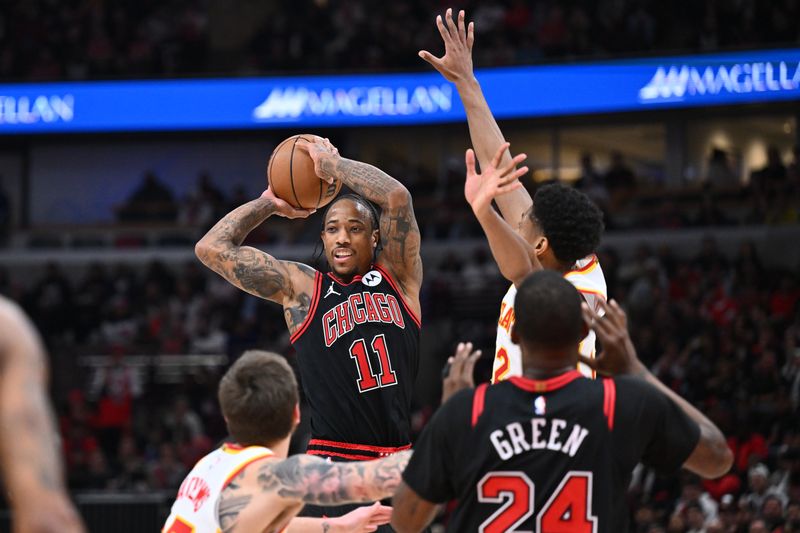 CHICAGO, ILLINOIS - APRIL 17:  DeMar DeRozan #11 of the Chicago Bulls looks to pass the ball in the second half against the Atlanta Hawks on April 17, 2024 at United Center in Chicago, Illinois. Chicago defeated Atlanta 131-116.   NOTE TO USER: User expressly acknowledges and agrees that, by downloading and or using this photograph, User is consenting to the terms and conditions of the Getty Images License Agreement.  (Photo by Jamie Sabau/Getty Images)