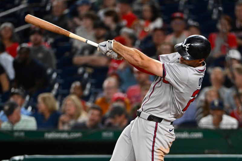 Sep 15, 2025; Washington, District of Columbia, USA; Atlanta Braves first baseman Matt Olson (28) hits a three run home run against the Washington Nationals during the fifth inning at Nationals Park. Mandatory Credit: Brad Mills-Imagn Images