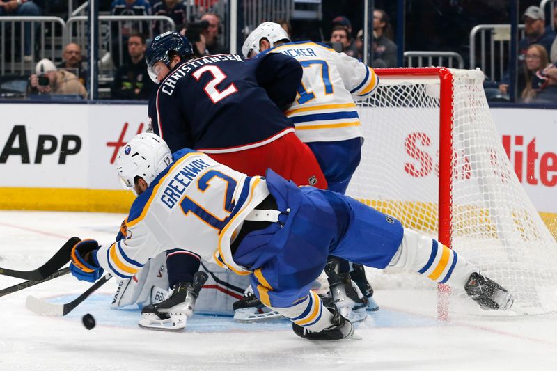 Oct 17, 2024; Columbus, Ohio, USA; Buffalo Sabres left wing  Jordan Greenway (12) falls to the ice as reaches for a rebound of a Columbus Blue Jackets goalie Jet Greaves (73) save during the third period at Nationwide Arena. Mandatory Credit: Russell LaBounty-Imagn Images