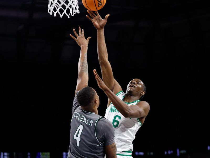 Mar 15, 2025; Fort Worth, TX, USA; North Texas Mean Green forward Brenen Lorient (6) shoots as UAB Blazers forward Christian Coleman (4) defends during the first half at Dickies Arena. Mandatory Credit: Chris Jones-Imagn Images