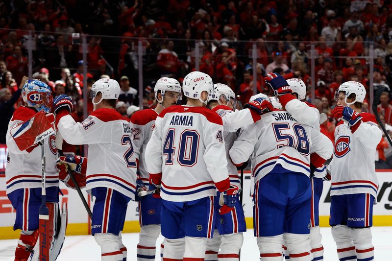 Apr 30, 2025; Washington, District of Columbia, USA; Montreal Canadiens defenseman David Savard (58) hugs teammates after game five of the first round of the 2025 Stanley Cup Playoffs against the Washington Capitals at Capital One Arena. Mandatory Credit: Geoff Burke-Imagn Images