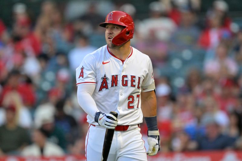 Jun 28, 2025; Anaheim, California, USA;  Los Angeles Angels designated hitter Mike Trout (27) returns to the dugout after striking out during the first inning against the Washington Nationals at Angel Stadium. Mandatory Credit: Jayne Kamin-Oncea-Imagn Images