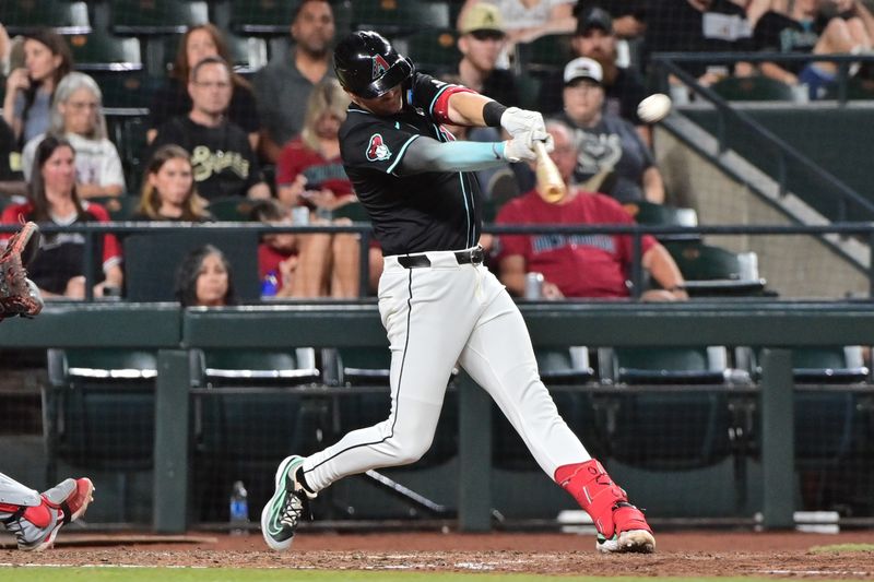 Jul 29, 2024; Phoenix, Arizona, USA;  Arizona Diamondbacks shortstop Kevin Newman (18) singles in the sixth inning against the Washington Nationals at Chase Field. Mandatory Credit: Matt Kartozian-USA TODAY Sports