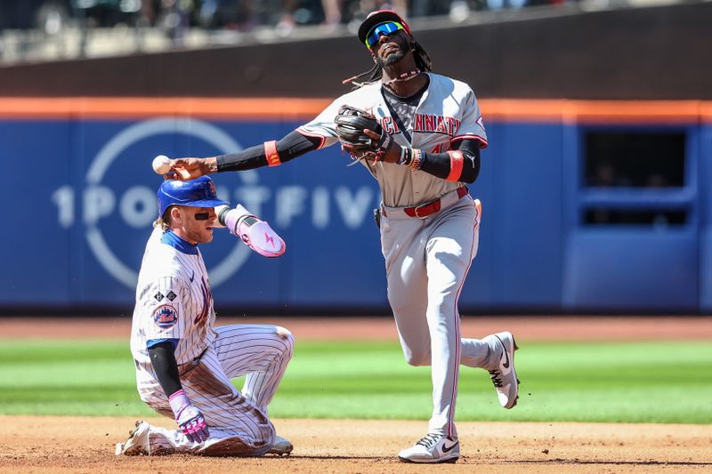 Sep 8, 2024; New York City, New York, USA;  Cincinnati Reds shortstop Elly De La Cruz (44) throws past New York Mets center fielder Harrison Bader (44) attempting to complete a double play in the third inning at Citi Field. Mandatory Credit: Wendell Cruz-Imagn Images