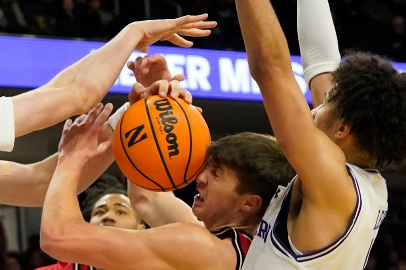 Jan 29, 2025; Evanston, Illinois, USA; Northwestern Wildcats guard Jalen Leach (1) defends Rutgers Scarlet Knights guard Jordan Derkack (0) during the first half at Welsh-Ryan Arena. Mandatory Credit: David Banks-Imagn Images
