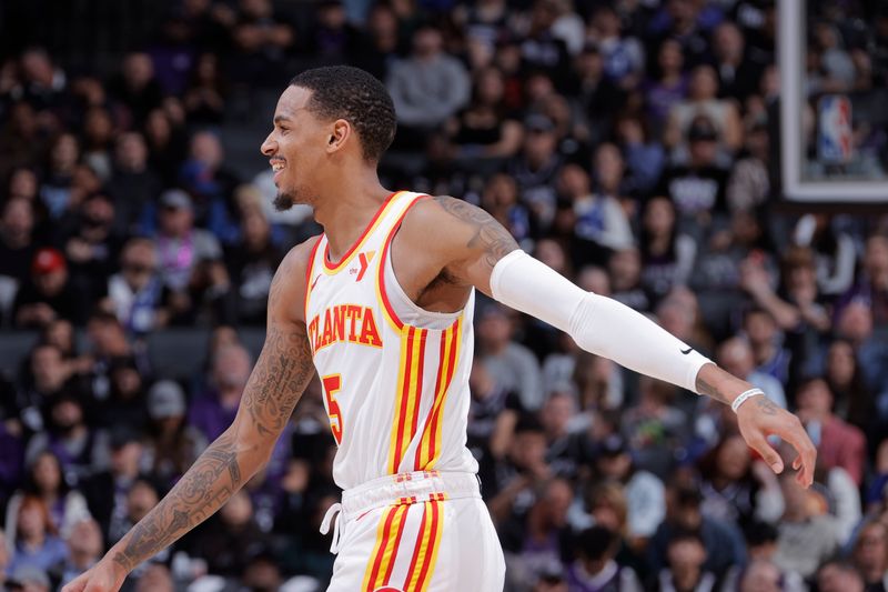 SACRAMENTO, CA - JANUARY 22: Dejounte Murray #5 of the Atlanta Hawks smiles during the game against the Sacramento Kings on January 22, 2024 at Golden 1 Center in Sacramento, California. NOTE TO USER: User expressly acknowledges and agrees that, by downloading and or using this Photograph, user is consenting to the terms and conditions of the Getty Images License Agreement. Mandatory Copyright Notice: Copyright 2024 NBAE (Photo by Rocky Widner/NBAE via Getty Images)