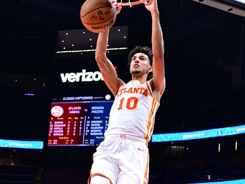 ATLANTA, GA - OCTOBER 8: Zaccharie Risacher #10 of the Atlanta Hawks dunks the ball during the game against the Indiana Pacers during a NBA preseason game on October 8, 2024 at State Farm Arena in Atlanta, Georgia.  NOTE TO USER: User expressly acknowledges and agrees that, by downloading and/or using this Photograph, user is consenting to the terms and conditions of the Getty Images License Agreement. Mandatory Copyright Notice: Copyright 2024 NBAE (Photo by Adam Hagy/NBAE via Getty Images)