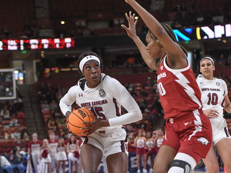 Mar 3, 2023; Greenville, SC, USA; South Carolina forward Laeticia Amihere (15) shoots near Arkansas forward Maryam Dauda (30) during the third quarter at Bon Secours Wellness Arena. Mandatory Credit: Ken Ruinard-USA TODAY Sports