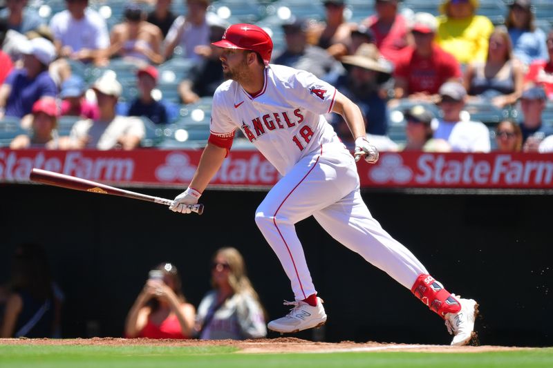 Jun 27, 2024; Anaheim, California, USA; Los Angeles Angels first baseman Nolan Schanuel (18) hits a single against the Detroit Tigers during the first inning at Angel Stadium. Mandatory Credit: Gary A. Vasquez-USA TODAY Sports