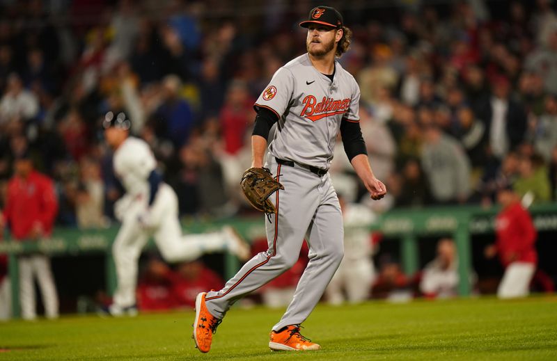 Apr 10, 2024; Boston, Massachusetts, USA; Baltimore Orioles pitcher Cole Irvin (19) looks on as Boston Red Sox first base Triston Casas (36) runs the bases after hitting a two run home run in the fifth inning at Fenway Park. Mandatory Credit: David Butler II-USA TODAY Sports