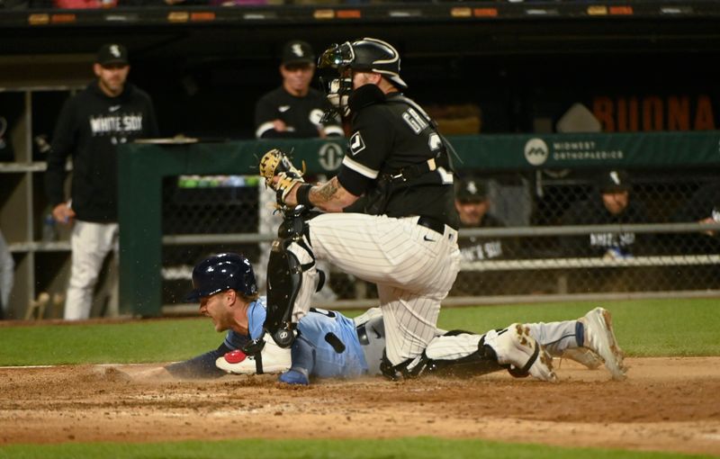 Apr 29, 2023; Chicago, Illinois, USA; Tampa Bay Rays second baseman Taylor Walls (6) is tagged out at home by Chicago White Sox catcher Yasmani Grandal (24) during the seventh inning at Guaranteed Rate Field. Mandatory Credit: Matt Marton-USA TODAY Sports