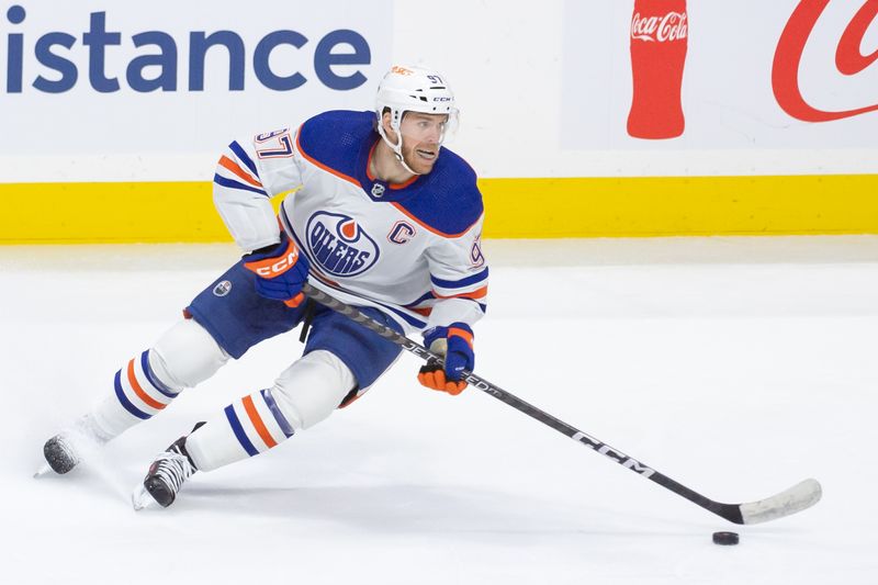 Mar 24, 2024; Ottawa, Ontario, CAN; Edmonton Oilers center Connor McDavid (97) skates with the puck in the third period against the Ottawa Senators at the Canadian Tire Centre. Mandatory Credit: Marc DesRosiers-USA TODAY Sports