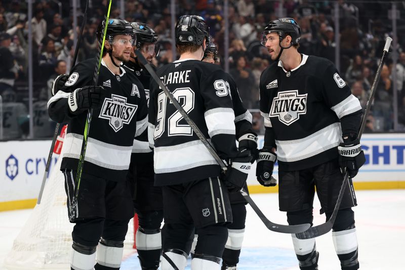 Nov 23, 2024; Los Angeles, California, USA;  Los Angeles Kings right wing Adrian Kempe (9) celebrates with teammates after scoring a goal during the second period against the Seattle Kraken at Crypto.com Arena. Mandatory Credit: Kiyoshi Mio-Imagn Images