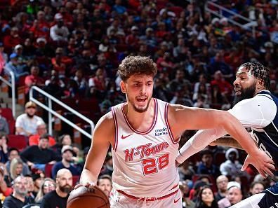 HOUSTON, TX - DECEMBER 22:   Alperen Sengun #28 of the Houston Rockets drives to the basket during the game against the Dallas Mavericks on December 22, 2023 at the Toyota Center in Houston, Texas. NOTE TO USER: User expressly acknowledges and agrees that, by downloading and or using this photograph, User is consenting to the terms and conditions of the Getty Images License Agreement. Mandatory Copyright Notice: Copyright 2023 NBAE (Photo by Logan Riely/NBAE via Getty Images)