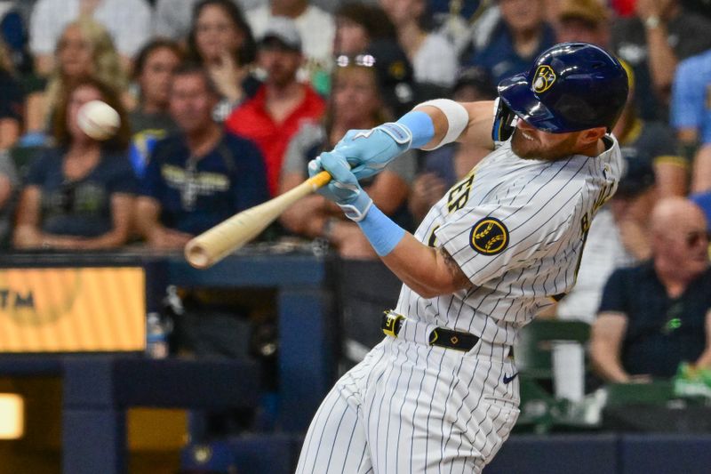 Jul 28, 2024; Milwaukee, Wisconsin, USA; Milwaukee Brewers first baseman Jake Bauers (9) hits a 2-run home run in the first inning against the Miami Marlins at American Family Field. Mandatory Credit: Benny Sieu-USA TODAY Sports