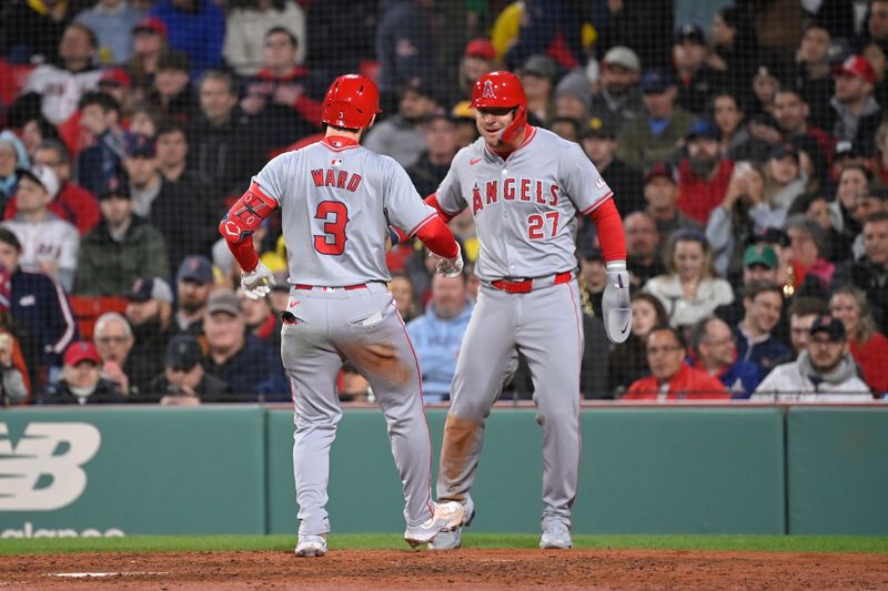 Apr 12, 2024; Boston, Massachusetts, USA; Los Angeles Angels left fielder Taylor Ward (3) celebrates his two run home run against the Boston Red Sox  with center fielder Mike Trout (27) during the sixth inning at Fenway Park. Mandatory Credit: Eric Canha-USA TODAY Sports