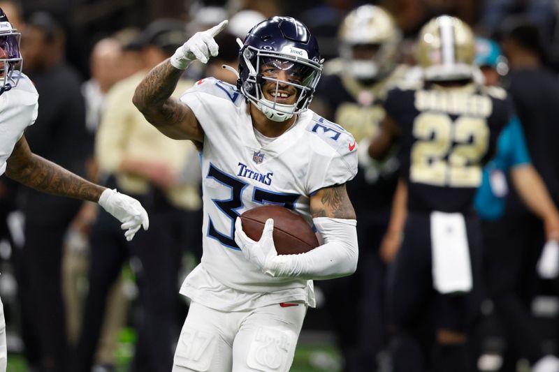 Tennessee Titans safety Amani Hooker celebrates an interception against the New Orleans Saints in the first half of an NFL football game in New Orleans, Sunday, Sept. 10, 2023. (AP Photo/Butch Dill)